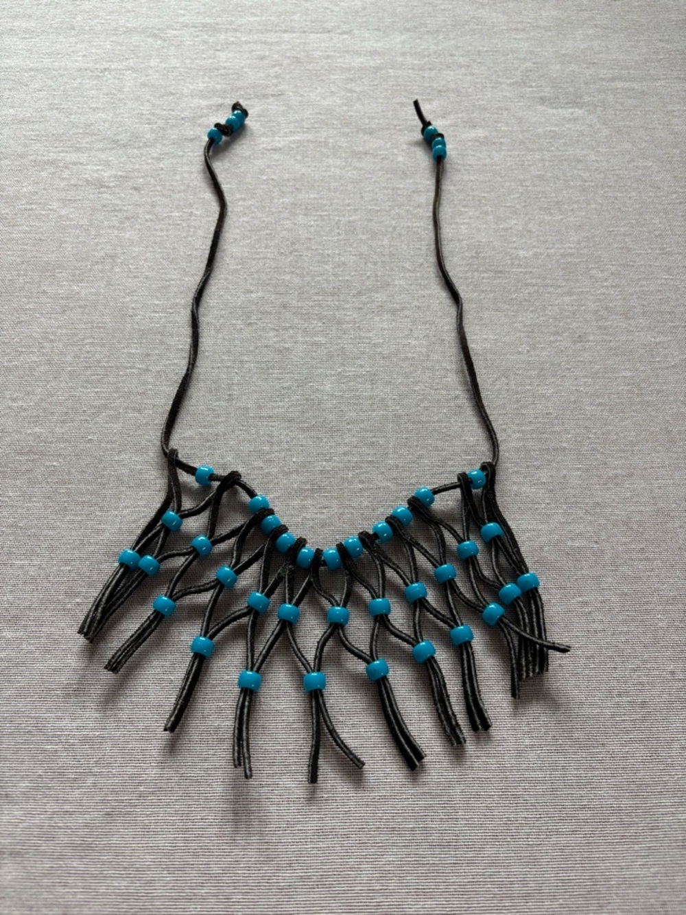 Vintage rawhide fringe beaded necklace.